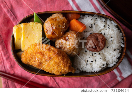 japanese style bento in wooden box with meat ball and croquette 72184634