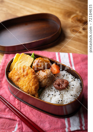 japanese style bento in wooden box with meat ball and croquette 72184635