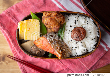 japanese style bento in wooden box with salmon and fried chicken 72184638