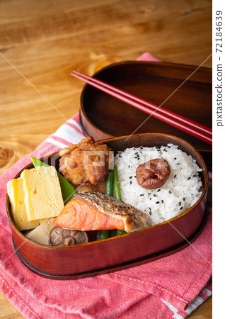 japanese style bento in wooden box with salmon and fried chicken japanese style bento in wooden box with salmon and fried chicken 72184639