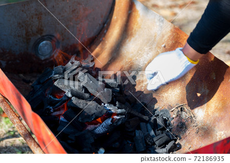 A state of lighting a barbecue A state of lighting a barbecue 72186935