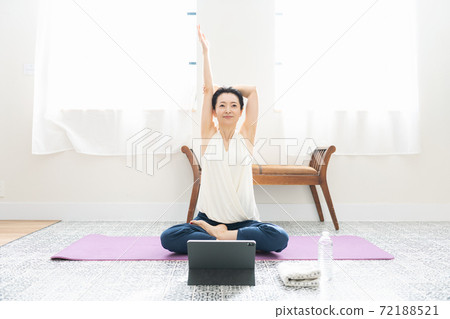 Middle woman stretching at home 72188521