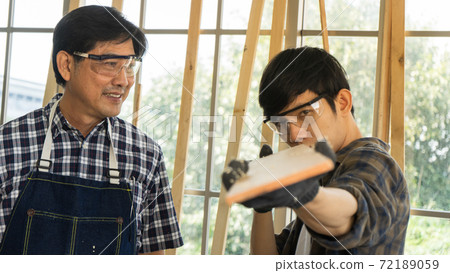 carpenter repairing the house 72189059