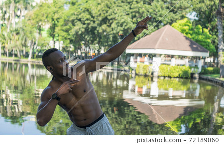 African American young man exercise in garden. 72189060