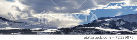 Panorama of winter mountains at evening 72189075