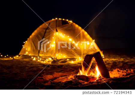 The fire at night on the beach. Summer mood The fire at night on the beach. Summer mood 72194343