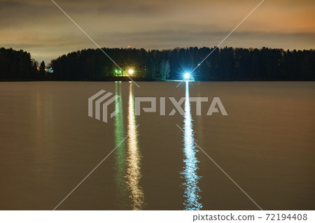 Long exposure photography. Photography of Russian landscape. Snowy Russian winter coming. Resting Istra water Reservoir. Concept of  the beauty in nature. Lights of the camping 72194408