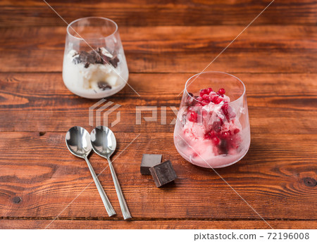 Two portions of vanilla and strawberry ice cream in glass Two portions of vanilla and strawberry ice cream in glass 72196008