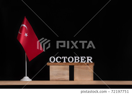 Wooden calendar of October with Turkish flag on black background. Holidays of Turkey in October 72197751