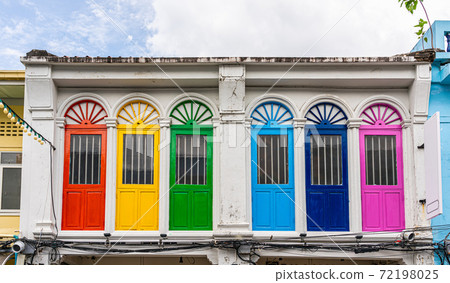 Old Portuguese style building with colorful wooden windows in old town Phuket, Thailand. Old Portuguese style building with colorful wooden windows in old town Phuket, Thailand. 72198025