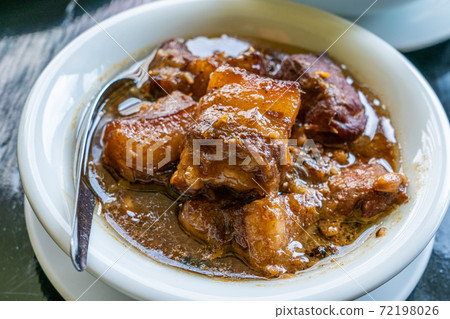 Thai style Braised Pork Belly, Phuket pork stew - close up. Thai style Braised Pork Belly, Phuket pork stew - close up. 72198026