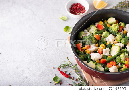 fresh vegetables - broccoli, green beans, peas, cauliflower stewed in a saucepan fresh vegetables - broccoli, green beans, peas, cauliflower stewed in a saucepan 72198395
