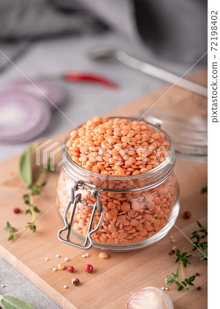 dry red lentils with spices in a glass jar dry red lentils with spices in a glass jar 72198402