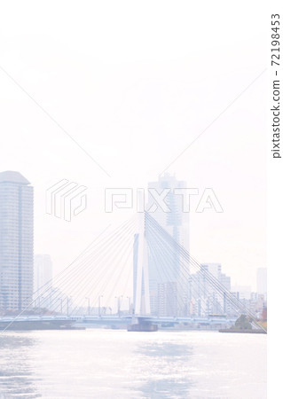 Scenery of a waterside town full of light Chuo Bridge over the Sumida River and the town Watercolor style vertical 72198453