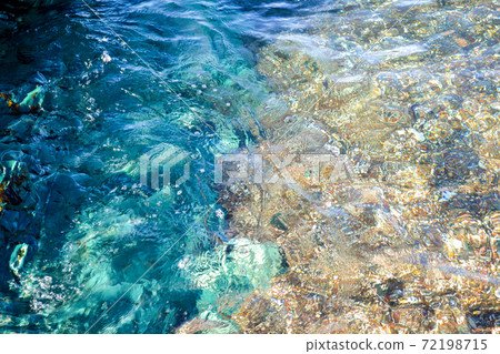 Underwater sea stones, surface with ripples and waves, beautiful pattern transparent clear water Underwater sea stones, surface with ripples and waves, beautiful pattern transparent clear water 72198715