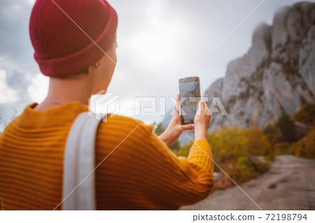 Outdoor fashion photo of young beautiful lady surrounded autumn forest in mountains Outdoor fashion photo of young beautiful lady surrounded autumn forest in mountains 72198794