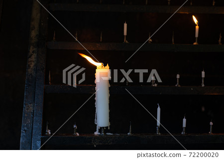 Candle fire swaying in the wind Candle fire swaying in the wind 72200020