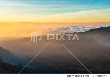 Beautiful sunrise over sea of fog at Mount Bromo in Bromo Tengger Semeru National Park, East Java, Indonesia Beautiful sunrise over sea of fog at Mount Bromo in Bromo Tengger Semeru National Park, East Java, Indonesia 72200045