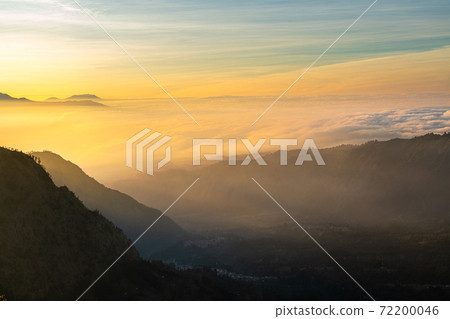 Beautiful sunrise over sea of fog at Mount Bromo in Bromo Tengger Semeru National Park, East Java, Indonesia Beautiful sunrise over sea of fog at Mount Bromo in Bromo Tengger Semeru National Park, East Java, Indonesia 72200046