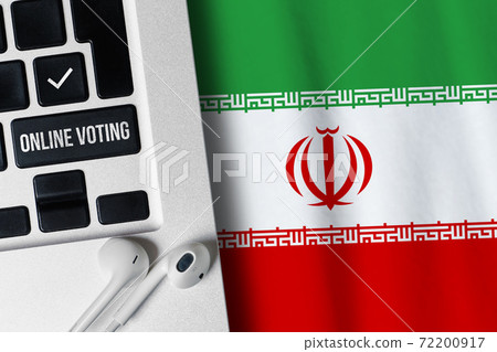 Online voting concept in Islamic Republic of Iran. Keyboard near country flag Online voting concept in Islamic Republic of Iran. Keyboard near country flag 72200917