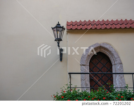 entrance with rustic door and a wall lantern entrance with rustic door and a wall lantern 72201202