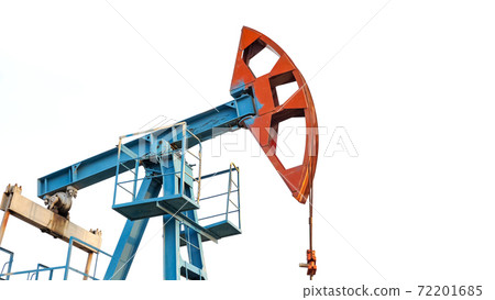 Oil pump jack rocking with pipeline in the background. Rocking machines for power generation 72201685
