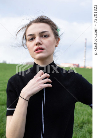 Dark hair girl on field with sky Dark hair girl on field with sky 72201822