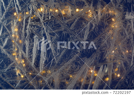 White freeze, ice crystal texture on blue background with bokeh. 72202197