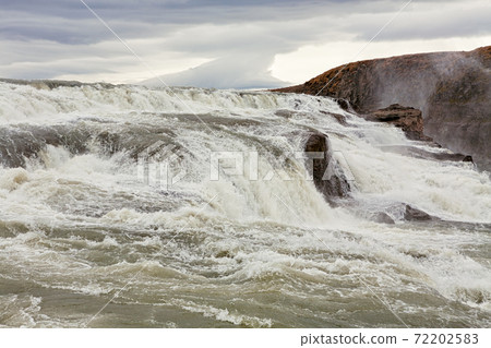 Gullfoss waterfall in a cloudy day Gullfoss waterfall in a cloudy day 72202583