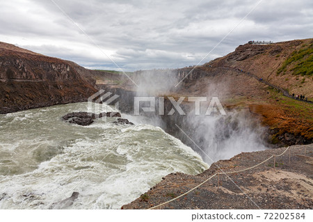 Gullfoss waterfall in a cloudy day 72202584