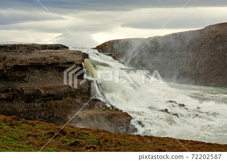 Gullfoss waterfall in a cloudy day 72202587