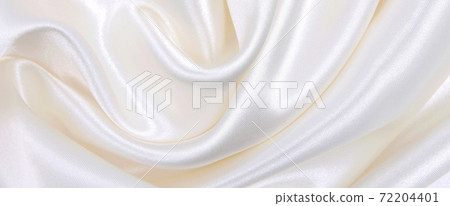 Smooth elegant white silk or satin luxury cloth texture as wedding background. Luxurious background design Smooth elegant white silk or satin luxury cloth texture as wedding background. Luxurious background design 72204401