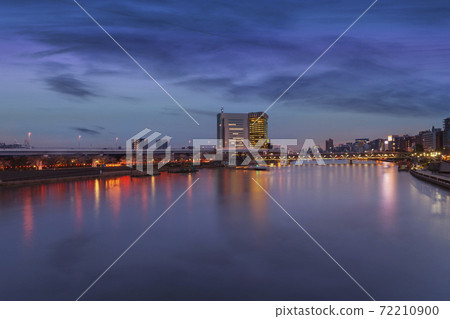 [Asakusa, Tokyo] Mansion along the Sumida River, Asahi Breweries Hall, and Bunkyo Ward Office sunset night view 72210900