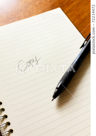 Copywriters who come up with catch phrase ideas with a notebook and pen Copywriters who come up with catch phrase ideas with a notebook and pen 72214472