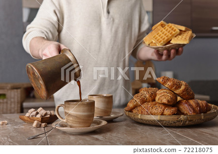 Breakfast with black coffee and fresh pastries Breakfast with black coffee and fresh pastries 72218075