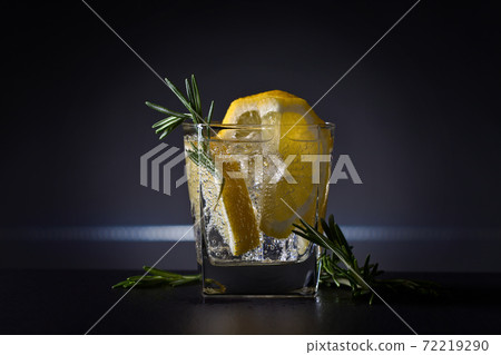 Cocktail with gin , tonic, lemon and ice. Cocktail with gin , tonic, lemon and ice. 72219290