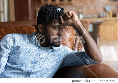 Frustrated young african ethnicity man thinking or life problems. 72220729
