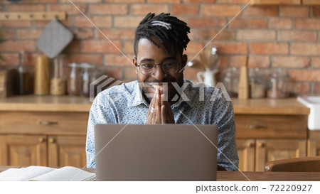 Excited young happy african man reading email with good news. Excited young happy african man reading email with good news. 72220927