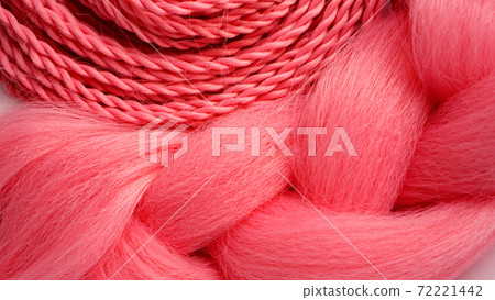 Pink kanekalon hangs on a white background 72221442