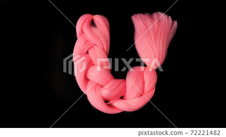 Pink kanekalon hang on a black background Pink kanekalon hang on a black background 72221482