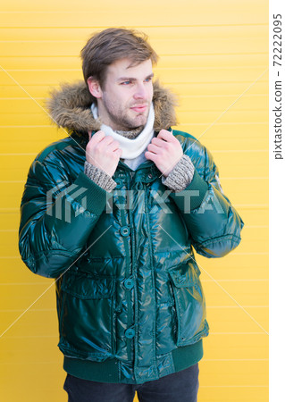 Man bearded hipster wear warm jacket with fur yellow Man bearded hipster wear warm jacket with fur yellow 72222095