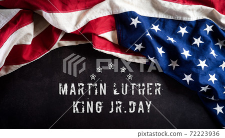 Happy Martin Luther King Day concept. American flag againt dark stone background Happy Martin Luther King Day concept. American flag againt dark stone background 72223936