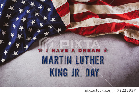 Happy Martin Luther King Day concept. American flag againt dark stone background Happy Martin Luther King Day concept. American flag againt dark stone background 72223937