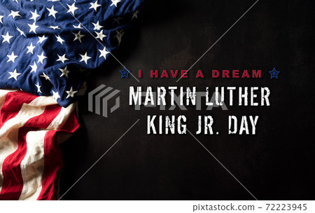 Happy Martin Luther King Day concept. American flag againt black wooden background Happy Martin Luther King Day concept. American flag againt black wooden background 72223945