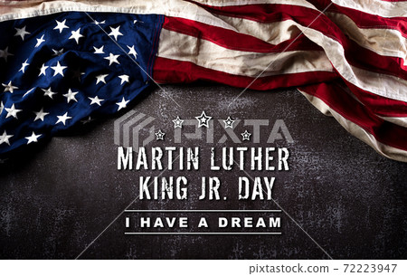 Happy Martin Luther King Day concept.  American flag againt dark stone background 72223947