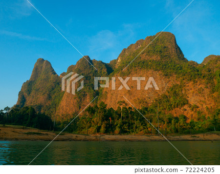 Rocky mountains in the morning sun (Khao Sok Lake, Surat Thani Province, Kingdom of Thailand) Rocky mountains in the morning sun (Khao Sok Lake, Surat Thani Province, Kingdom of Thailand) 72224205