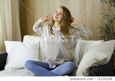 Happy brunette woman put hands behind head sitting leaned on couch european female enjoy lazy weekend or vacation in cozy living room, housewife relaxing feels satisfied after housework Happy brunette woman put hands behind head sitting leaned on couch european female enjoy lazy weekend or vacation in cozy living room, housewife relaxing feels satisfied after housework 72226208