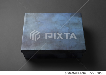 Shoe box in blue on a gray background. Shoe box in blue on a gray background. 72227053