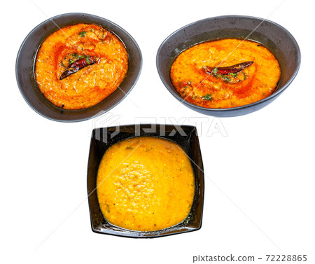 set of Dal Tadka chowder in black bowl isolated set of Dal Tadka chowder in black bowl isolated 72228865