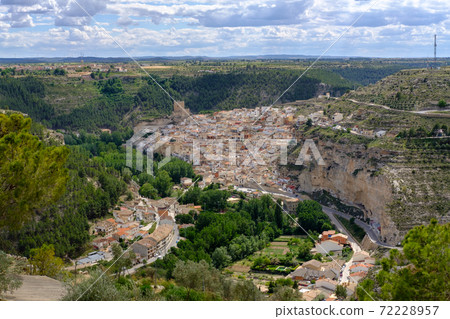 dusk view of Alcala del Jucar with river and bridge. Province of Albacete, Spain 72228957
